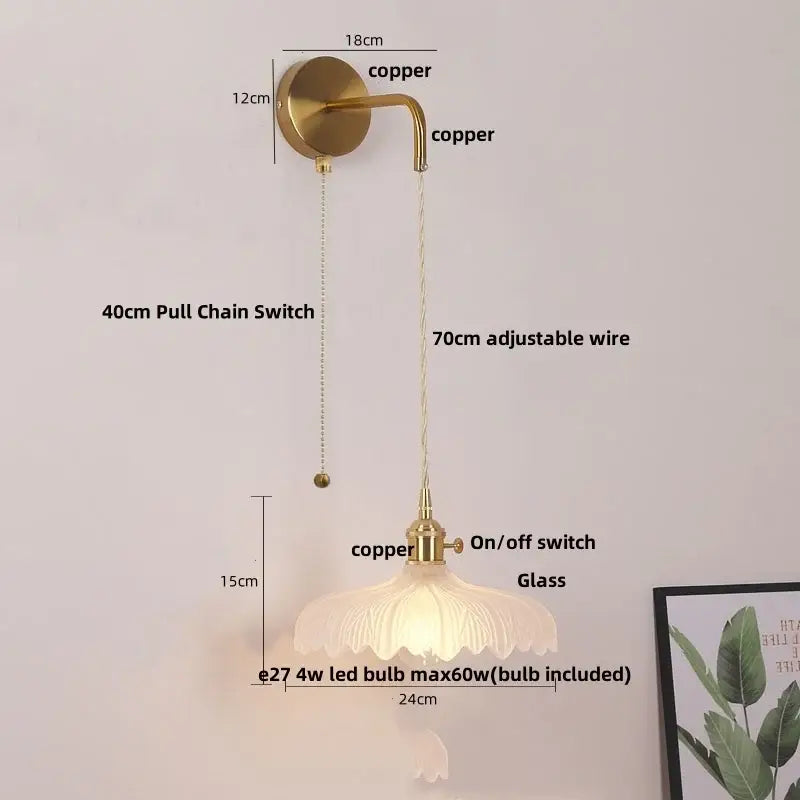 Vintage-style wall sconce with glass copper led fluted shade in brass finish for elegant bathroom lighting