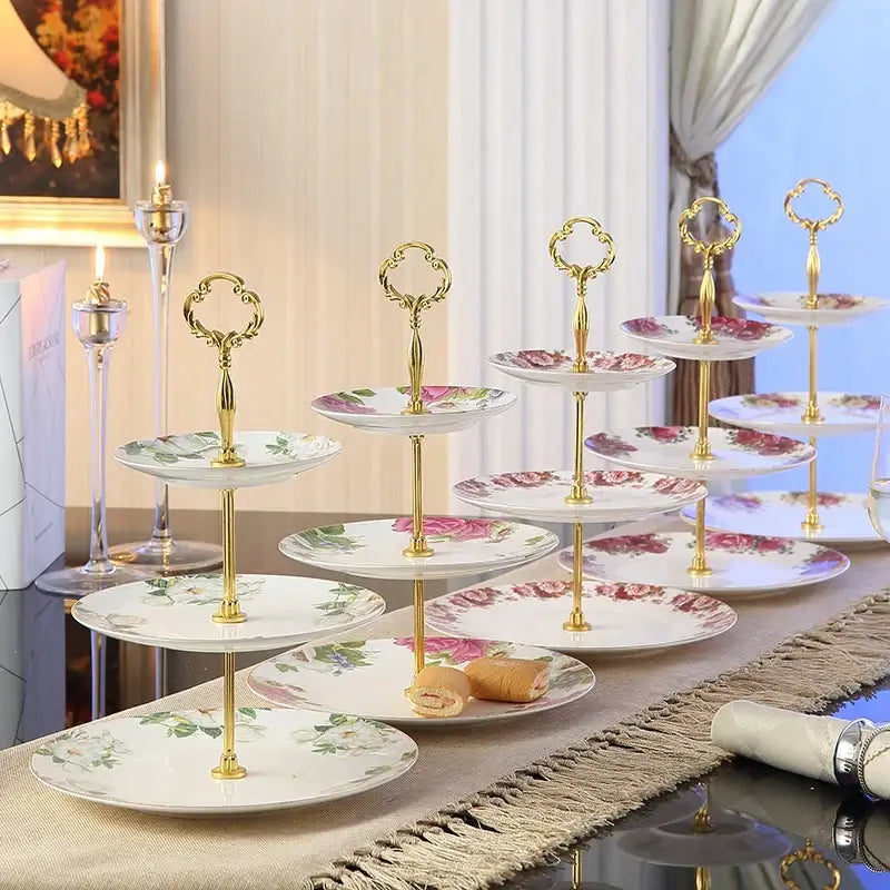 Gold-finished tiered dessert stand with white bone china fruit plates set featuring delicate pink and green floral patterns