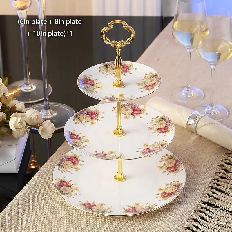 Three-tiered fruit plates set with floral gold bone china plates and ornate gold-toned handle for dining room use