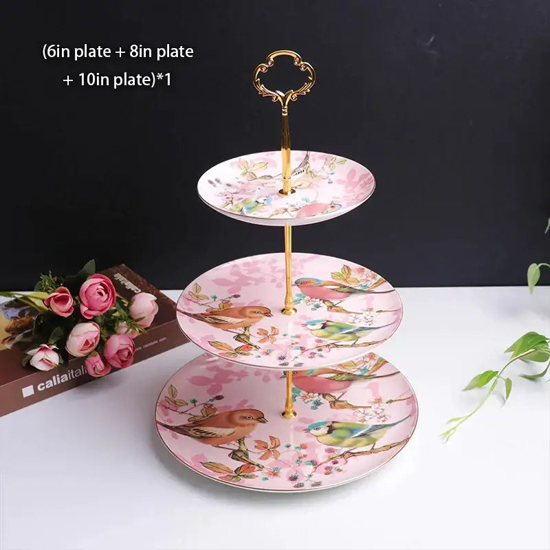 Three-tiered bone china fruit plates set with gold-toned handle and pink floral bird pattern for dining room use
