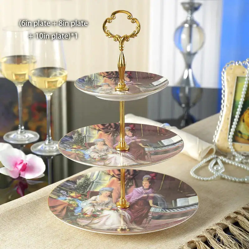Gold-toned three-tier bone china fruit plates set with ornate handle and decorative classical paintings for dining room