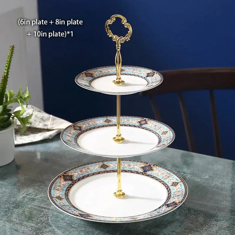 Three-tiered bone china fruit plates set with floral gold handle and decorative blue beige and dark brown pattern