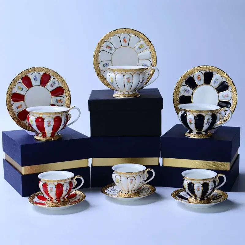 Elegant porcelain tea cup saucer set in red black and white with floral gold trim for dining room drinkware