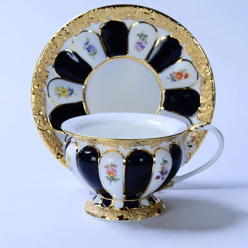 Elegant porcelain tea cup saucer set with black white and gold floral hand-painted designs for dining room use