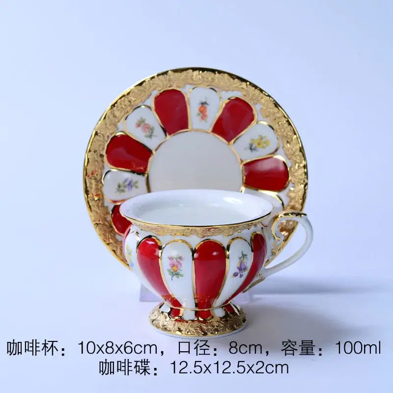 Elegant red and white porcelain tea cup with gold trim floral motifs in a fan-shaped design tea cup saucer set