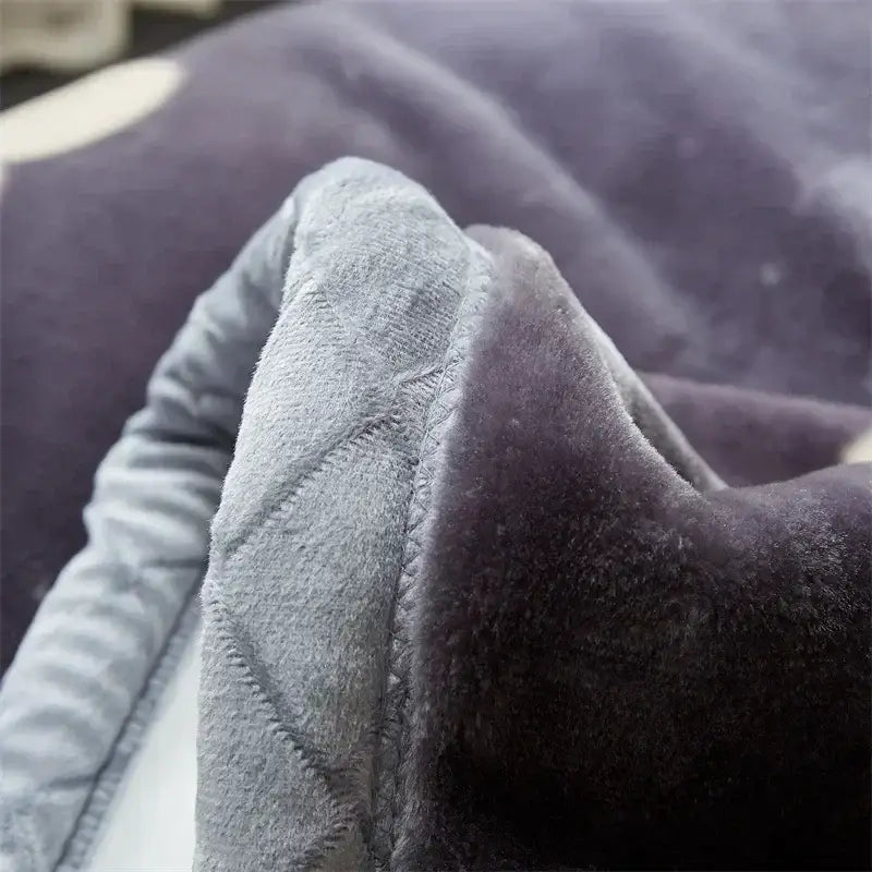 A dark gray plush cozy flocked raschel blanket with soft texture and visible stitching for bedroom bedding decorbites cozy flocked