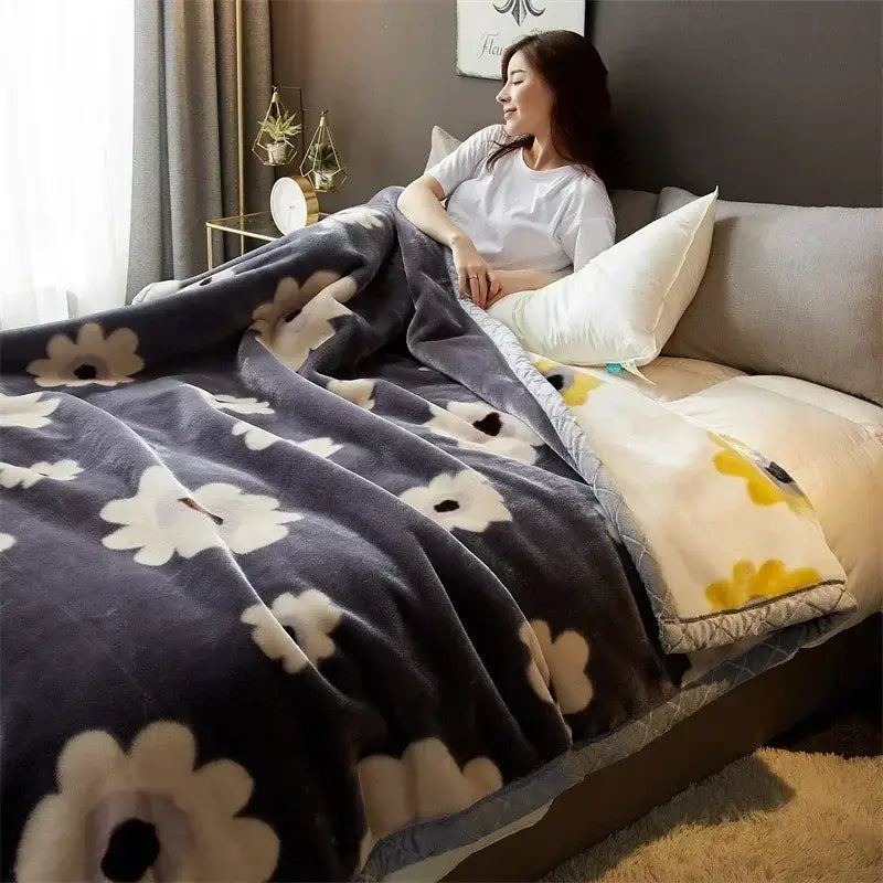 A plush navy blue cozy flocked raschel blanket with soft fuzzy texture and large white daisy patterns for decorbites cozy flocked bedding
