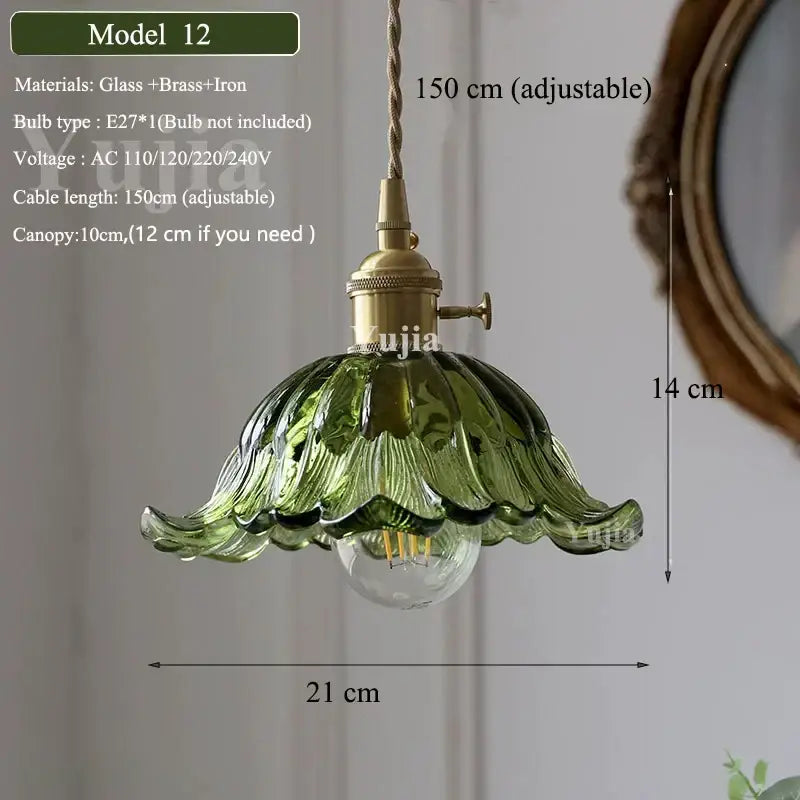 Model 12 vintage-style pendant light with olive-green petal-shaped green glass shade and brass hardware for kitchen use