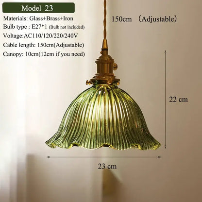 Vintage-style pendant light with ribbed olive green glass shade and brass-finished hardware for kitchen use