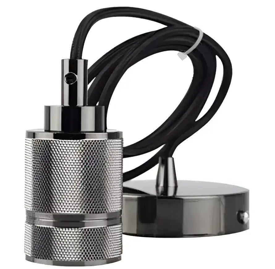 Industrial-style black and silver pendant light with textured metal body and braided cable complements floral green glass pendant lights