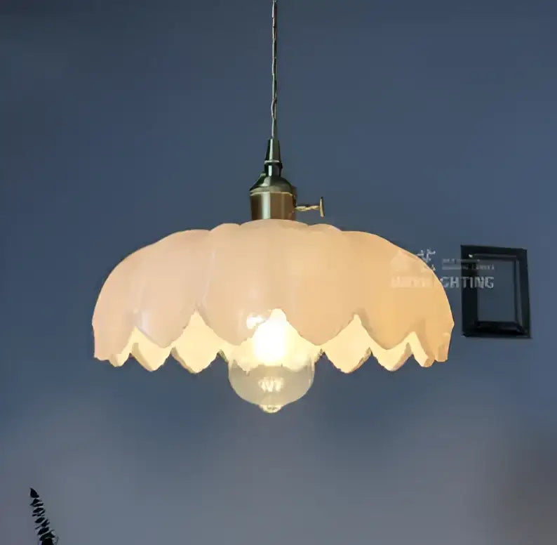 Vintage-style glass pendant light with soft peach scalloped shade and brass finish for dining room pendant lights