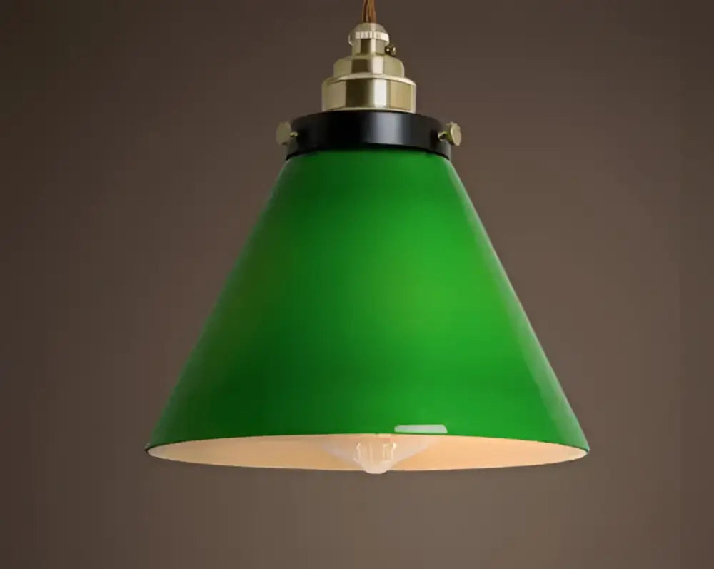 Floral green glass pendant light with brass and black hardware featuring conical shade for dining room pendant lights