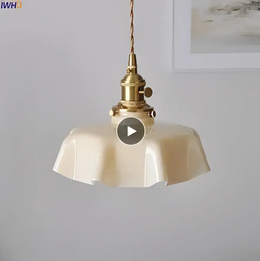 Cream-colored fluted glass pendant light with brass-finished metal fixture ideal for dining room glass pendant lights