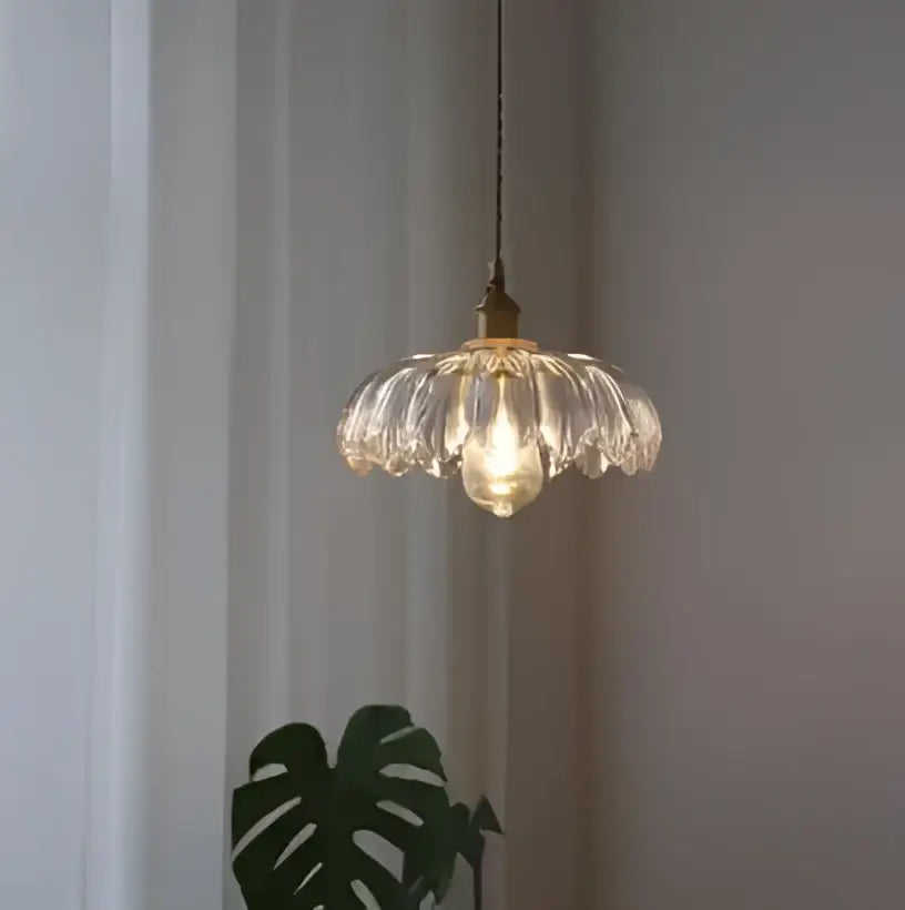 Floral green glass pendant light with petal-like shades and golden brass finish ideal for dining room pendant lights