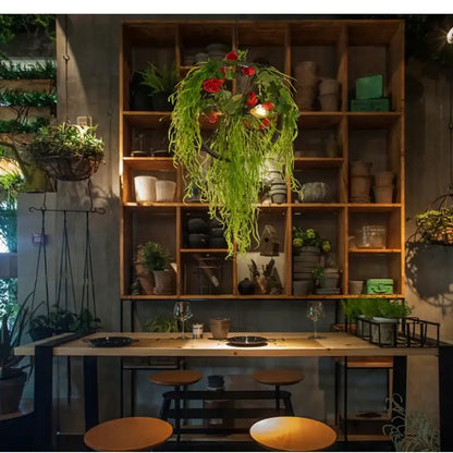 Floral green plant lighting chandelier with hanging green fronds and red flowers for dining room decorbites green plant