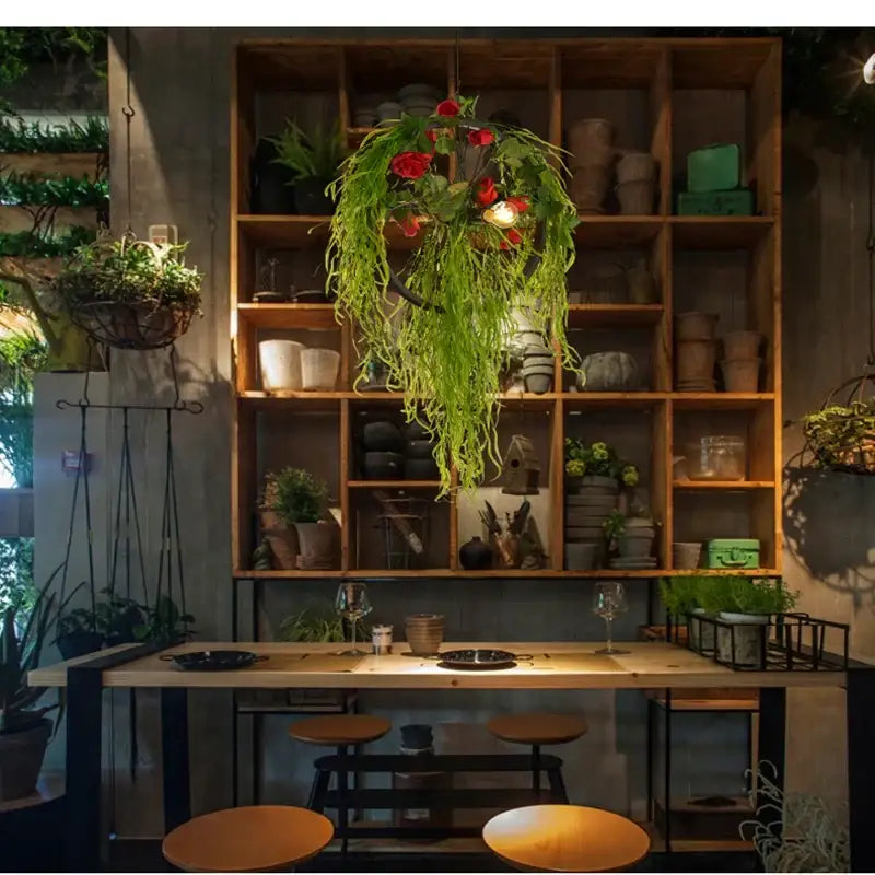 Floral green plant lighting chandelier with hanging green fronds and red flowers for dining room decorbites green plant