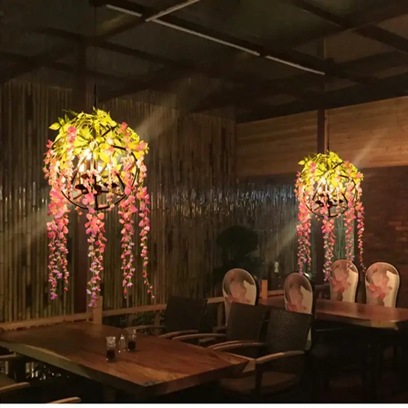 Floral green plant lighting chandelier with pink and yellow artificial flowers and black metal frames for dining room decorbites green plant