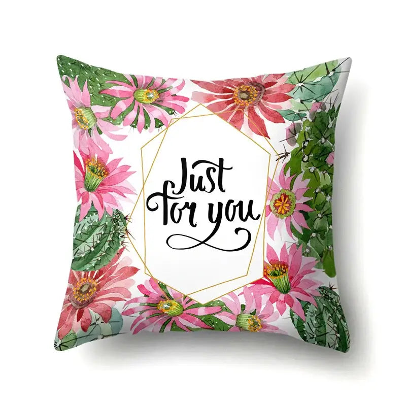 Square pillow cover featuring decorbites green tropical leaves with pink cactus flowers and just for you script