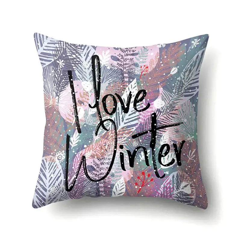 A square pillow cover with colorful purple, pink, teal, and gray green tropical leaves and snowflakes decorbites green tropical design