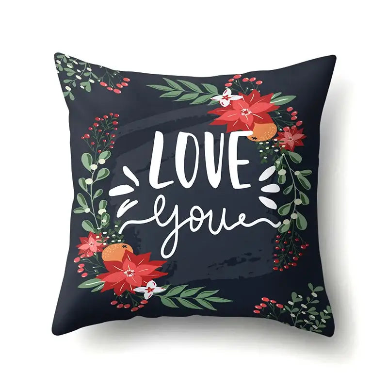 Dark navy pillow cover with vibrant red poinsettias and green tropical leaves wreath decorbites green tropical design