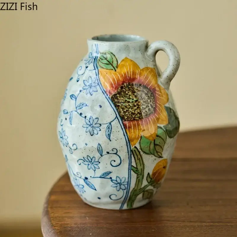 Floral hand painted decorbites ceramic vase with artificial flowers featuring yellow sunflowers and blue floral patterns