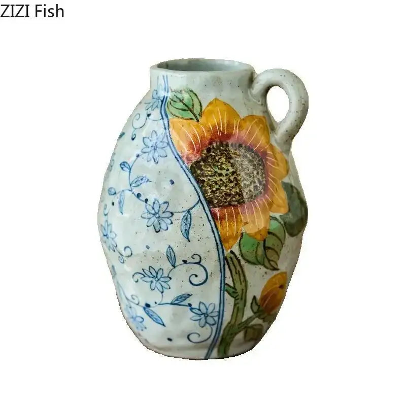 Floral hand painted decorbites ceramic vase with vibrant sunflower and blue floral patterns holding artificial flowers