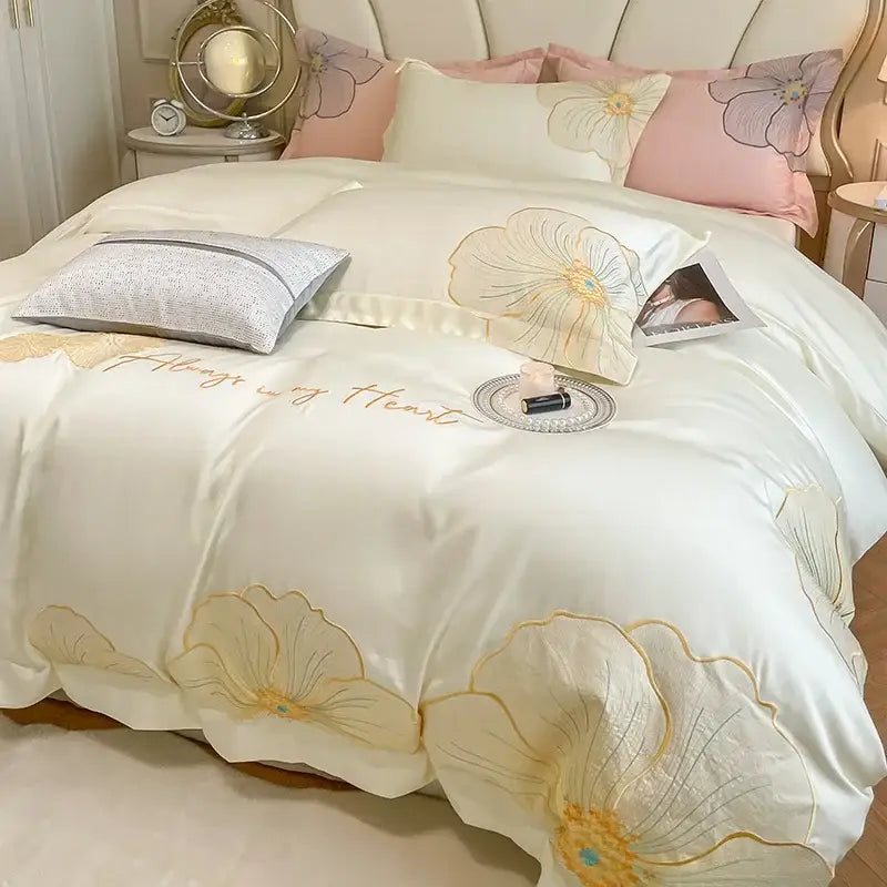 Cream-colored satin duvet cover with embroidered gold floral patterns and always in my heart stitching in egyptian cotton bedding set