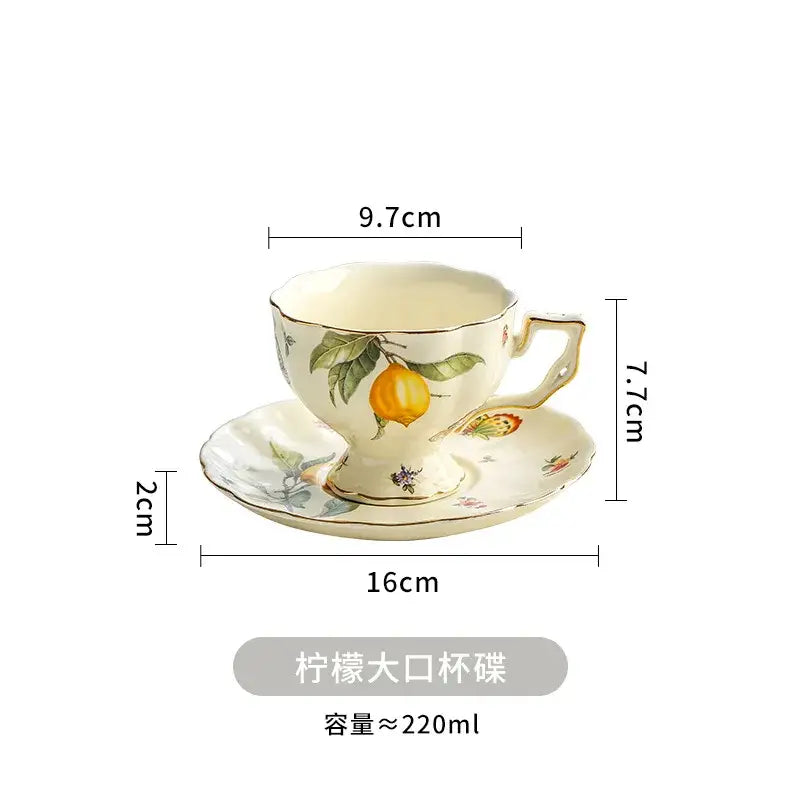 Cream-colored porcelain tea set with hand-painted citrus motifs and gold-trimmed edges for dining room use