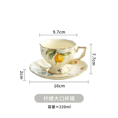 Cream-colored porcelain tea set with hand-painted citrus motifs and gold-trimmed edges for dining room use