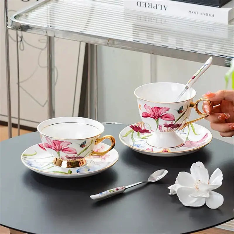 Elegant white porcelain lily flower tea set with pink floral patterns gold trim and matching spoon for dining room use