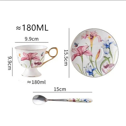 Delicate porcelain lily flower tea set with vibrant pink and blue iris flowers and butterflies on white background