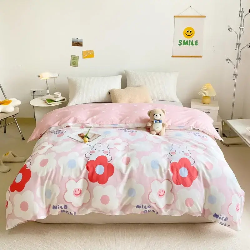 Pink floral cotton duvet cover with red and white flowers smiling faces and nico doll text for bedroom decorbites set