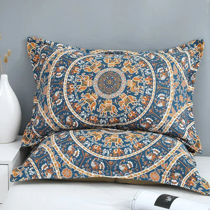 Blue and orange mandala-patterned pillowcases with intricate elephant designs complement floral navy and orange decorbites cotton picnic blanket bedspread