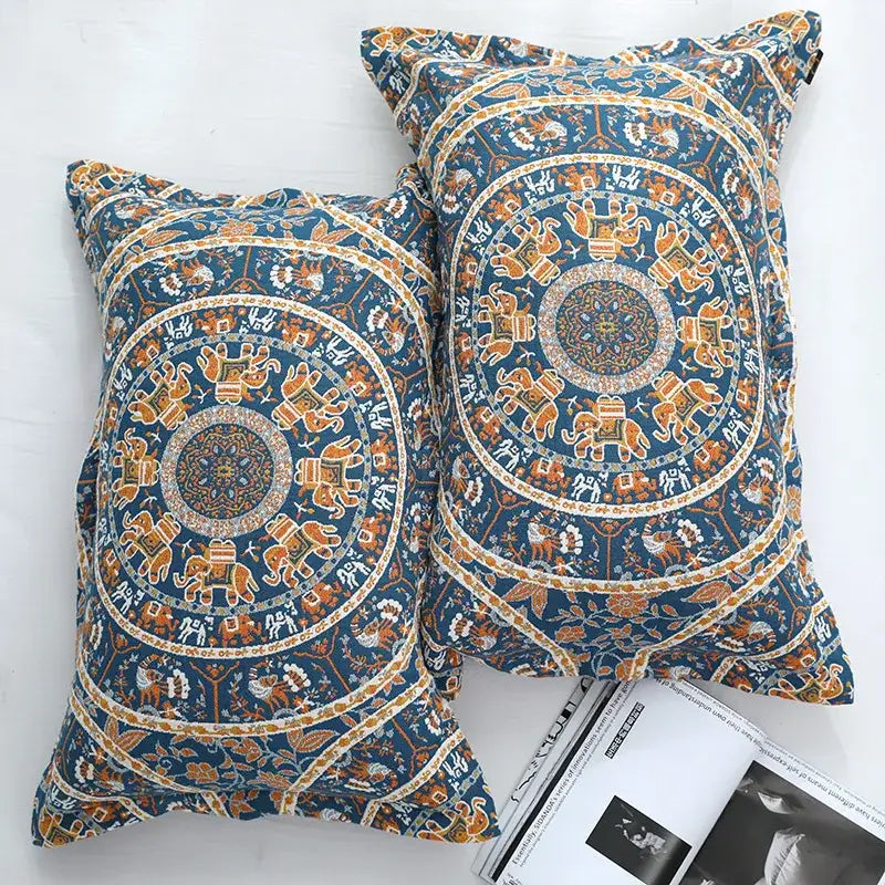 Blue and orange mandala-patterned pillowcases with intricate elephant designs complement decorbites cotton picnic blanket bedspread