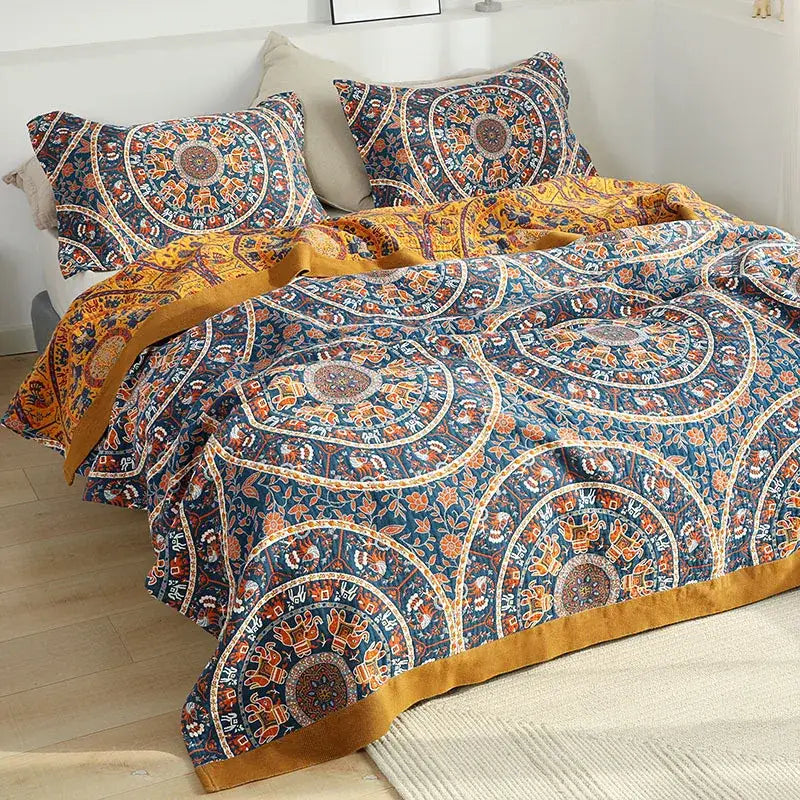 Floral navy and orange cotton picnic blanket bedspread featuring vibrant blue and gold mandala elephant designs