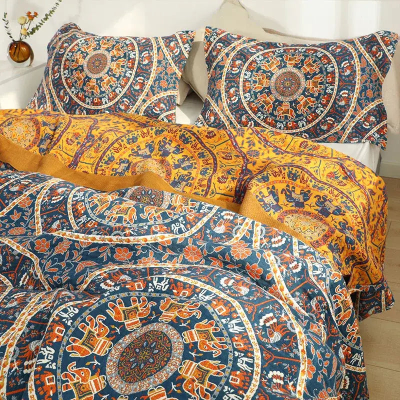 Floral navy and orange cotton picnic blanket bedspread with vibrant mandala and elephant patterns on textured fabric