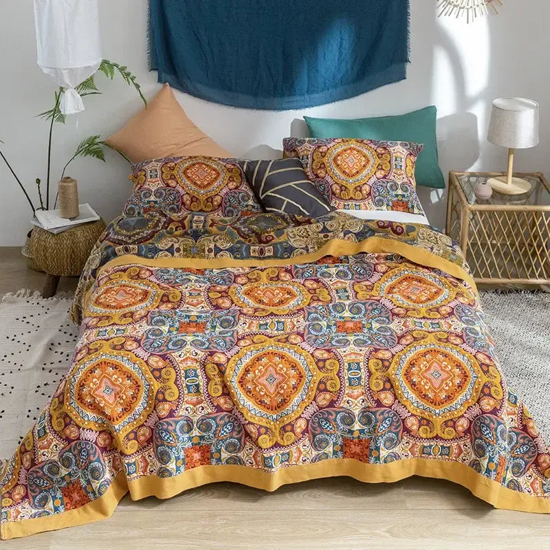 Vibrant floral orange and blue cotton summer throw blanket with a multi-colored mandala pattern and bold yellow border