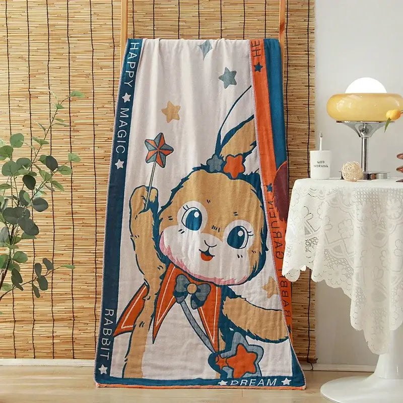 A soft white cotton gauze adult bath towel with cheerful rabbit design and happy magic text for decorbites cotton gauze decor