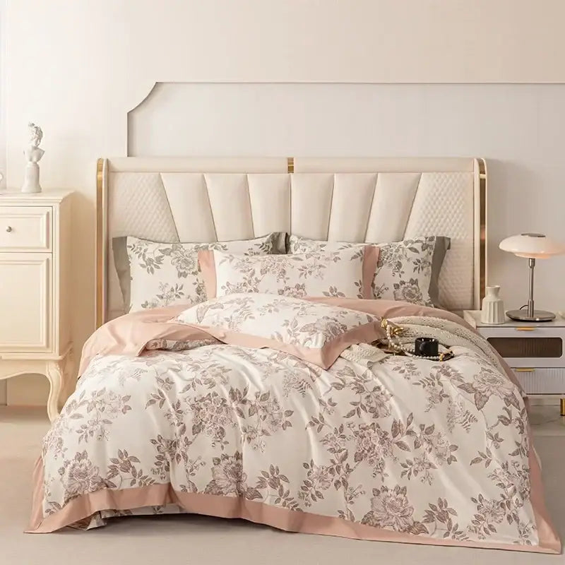 A soft blush-pink and cream floral duvet set featuring a delicate botanical pattern in decorbites 100s egyptian cotton