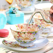 A delicate porcelain tea cup with floral pattern in pastel pinks yellows purples and gold trim from decorbites ceramic afternoon tea set
