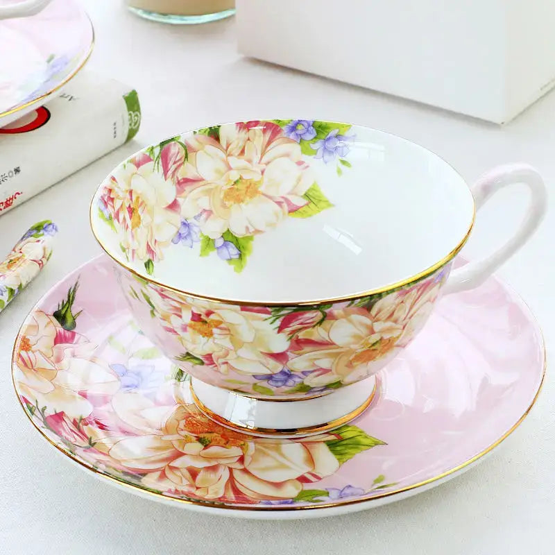 Delicate porcelain tea set with pastel floral pattern in cream pink and purple and gold trim for afternoon tea decorbites ceramic afternoon