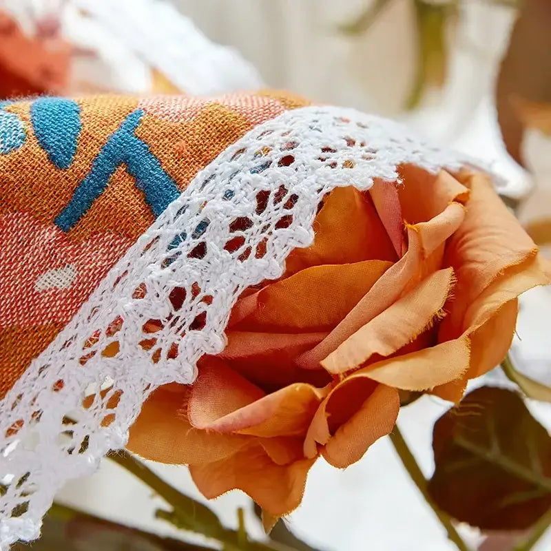 Orange fabric rose with white lace trim and blue embroidered pattern on floral patchwork breathable cotton gauze sofa cover decorbites breathable cotton