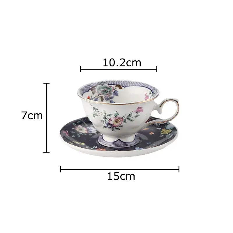 A porcelain ceramic cup and saucer set with decorbites flowers pattern in soft pastels and gold-trimmed rims