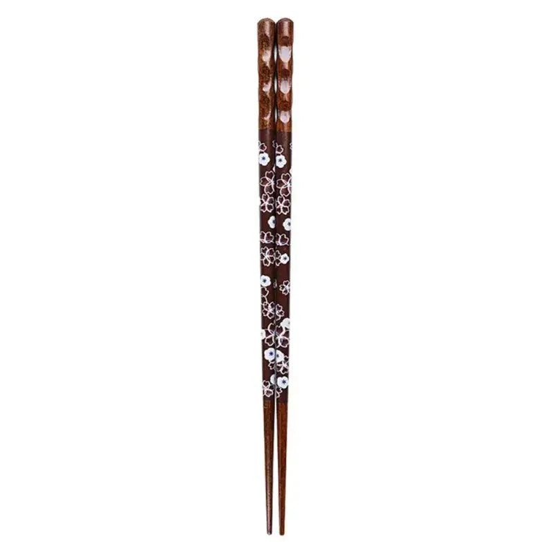 Dark brown bamboo wood chopsticks with white floral patterns and textured tips for an enhanced dining experience