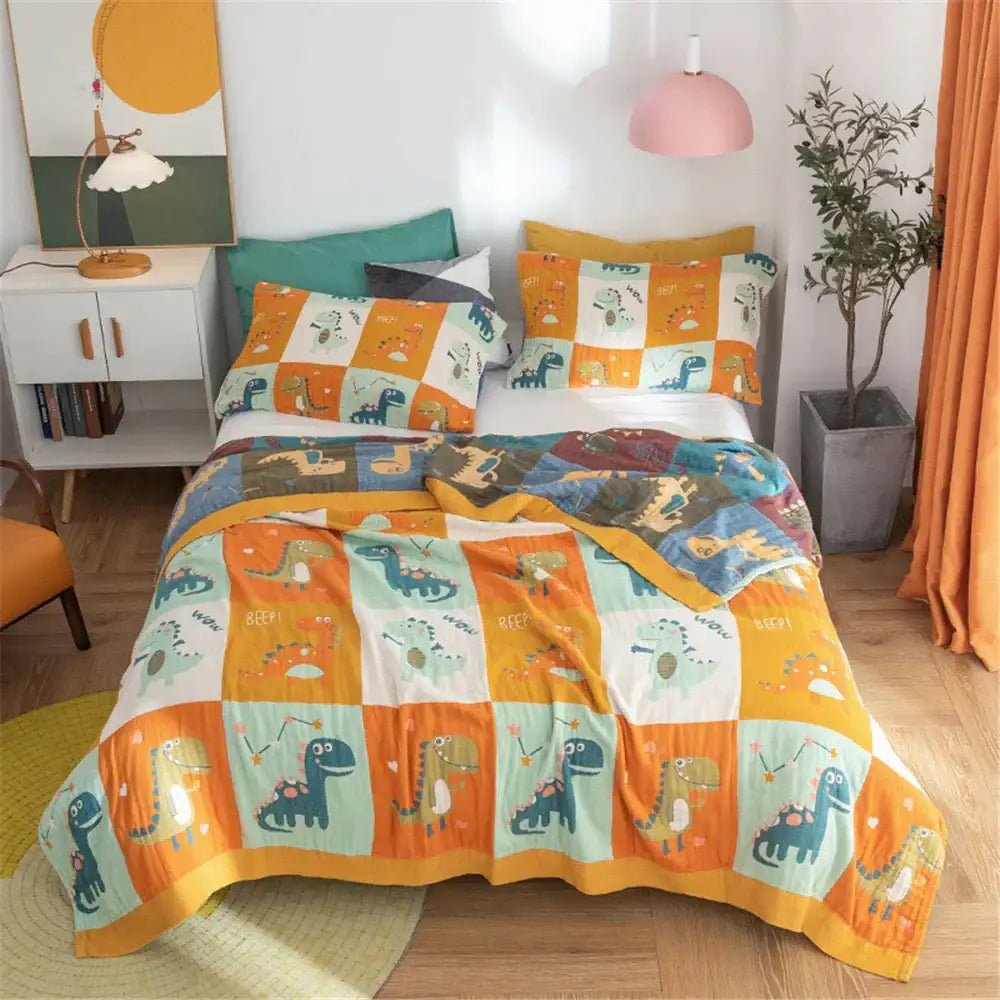 A cozy dinosaur-themed quilt set with orange teal and white cotton gauze towel blanket for bedroom decorbites cotton gauze