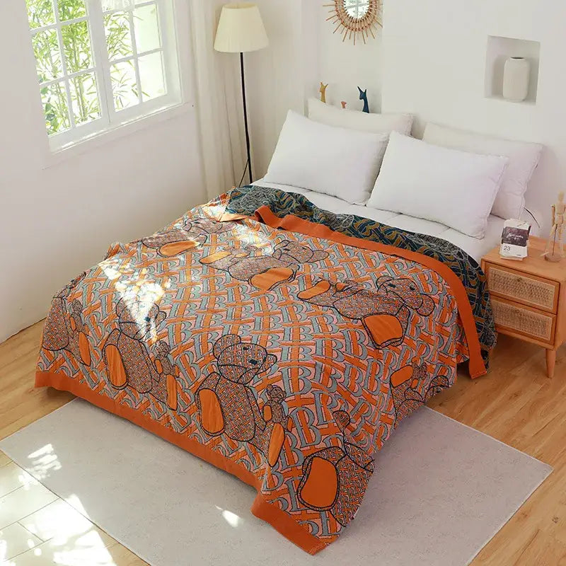 Floral pink and blue decorbites cotton gauze towel blanket with orange and gray teddy bear pattern and bold orange border