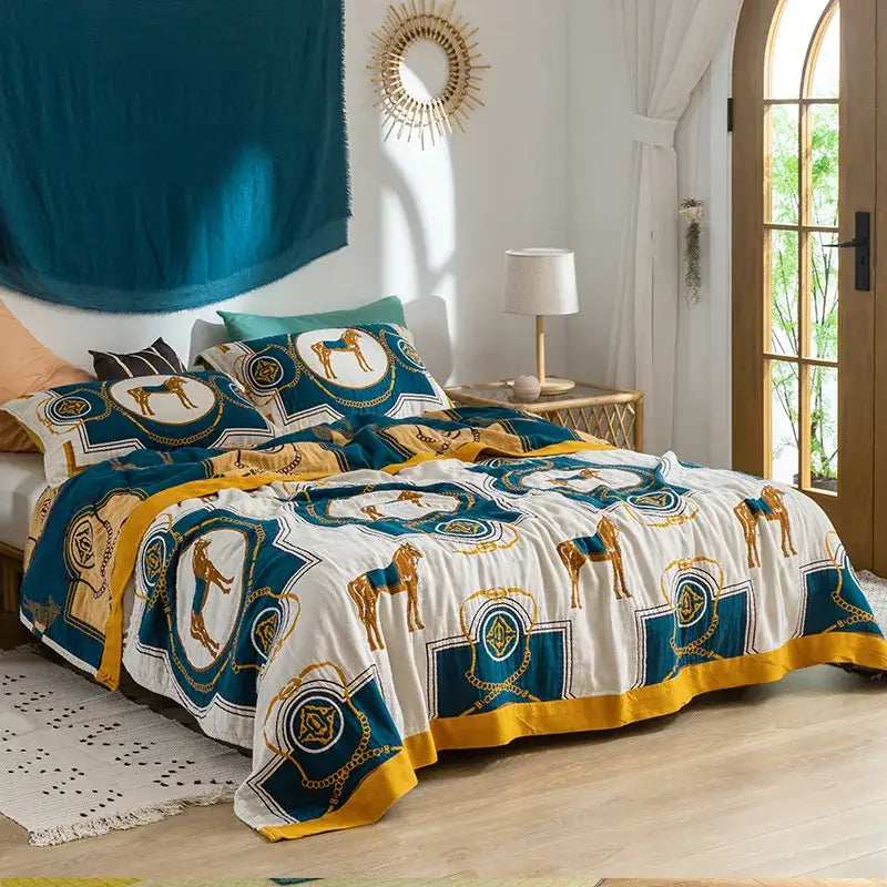 Teal and gold horse-patterned cotton gauze towel blanket with white base by decorbites for bedroom throw decor