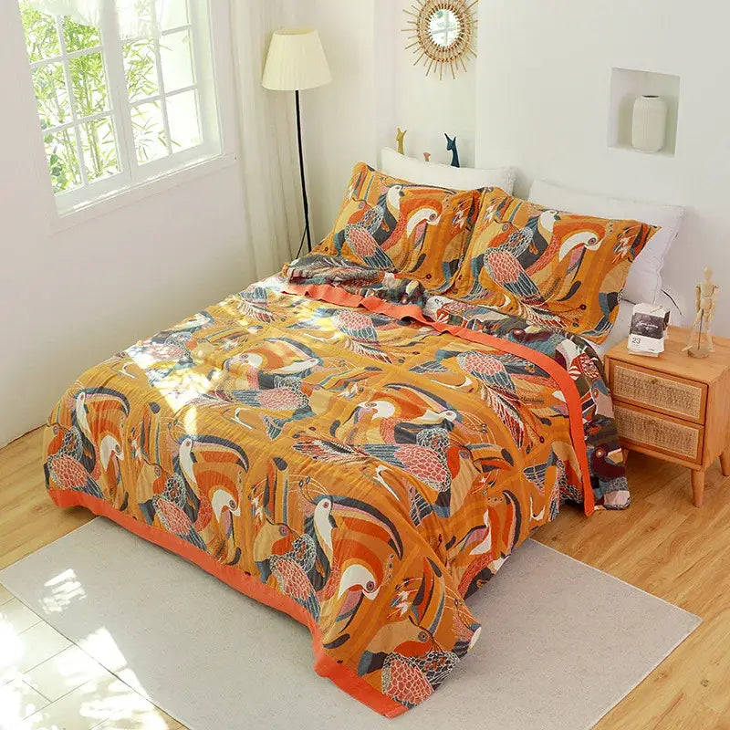 Floral pink and blue cotton gauze towel blanket with vibrant orange toucan pattern decorbites cotton gauze bedroom throw