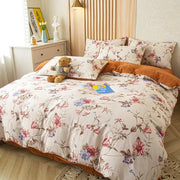 Floral pink and blue flower print bedding set with delicate blossoms on cream soft cotton for bedroom use