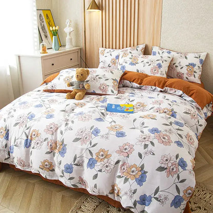 Floral pink and blue flower print bedding set with white cotton fabric featuring blue peach and gray blossoms